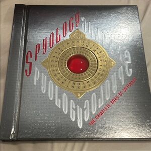 Spyology Book with Red and Gold Design